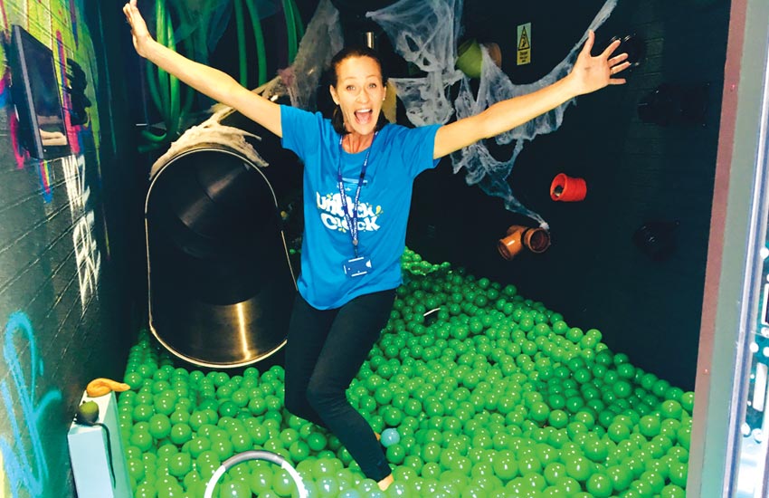 Inside the shipping container consumer experience for Yorkshire Water - black/green room