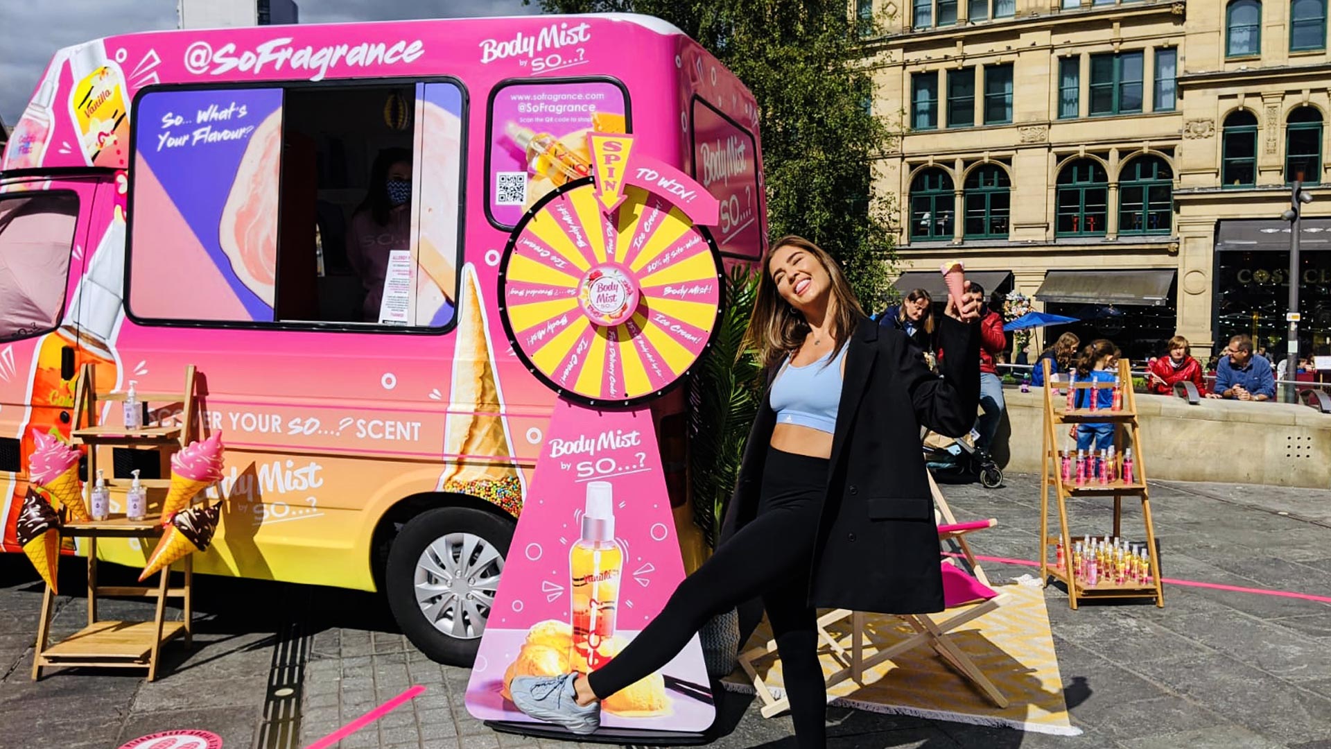 Lifestyle content creator posing with an ice cream cone at a custom iMP mobile beauty roadshow activation