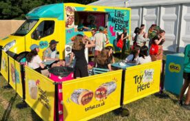 Tofoo branded van offering product samples to crowd of people