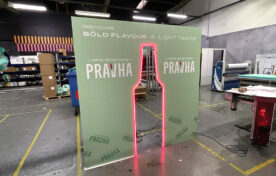 Pravha beer neon bottle outline experiential photo backdrop