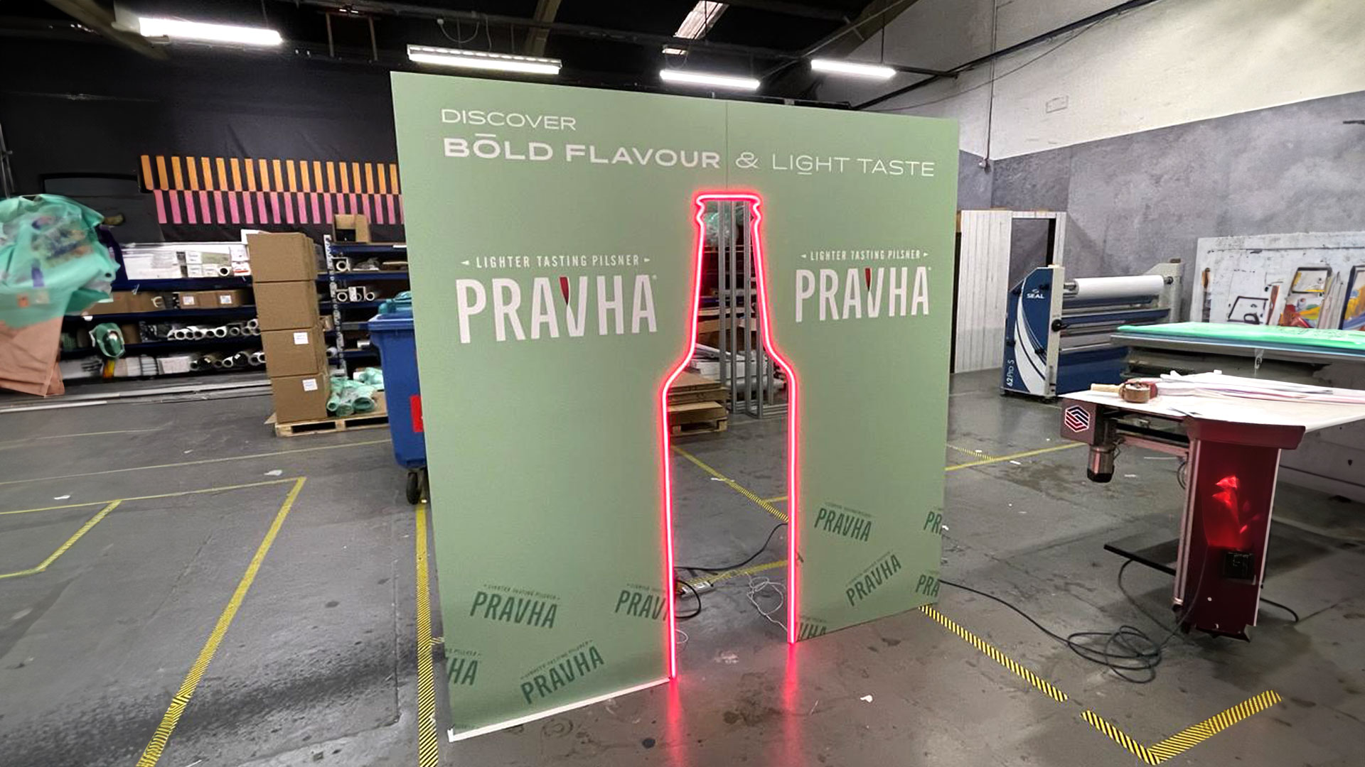 Pravha beer neon bottle outline experiential photo backdrop