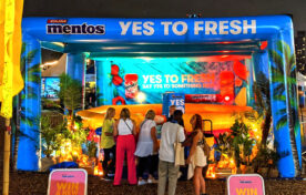 Festival attendees exploring the illuminated Mentos ‘Yes To Fresh’ inflatable brand activation at Barcode Festival
