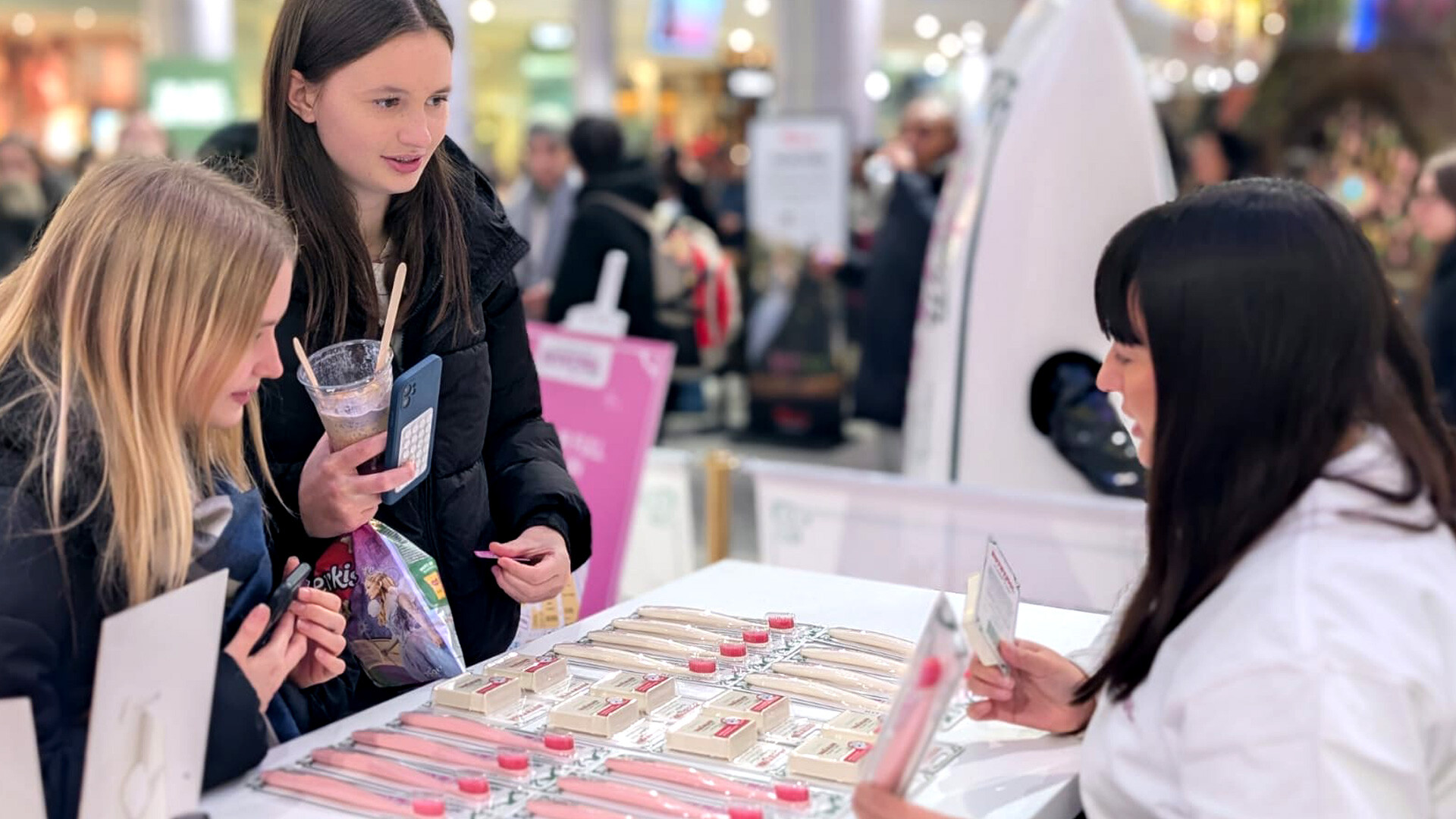iMP brand ambassadors showing Euthymol Toothpaste products to shoppers at Westfield London