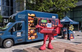 The Ritter Sport Mascot in front of the sampling van