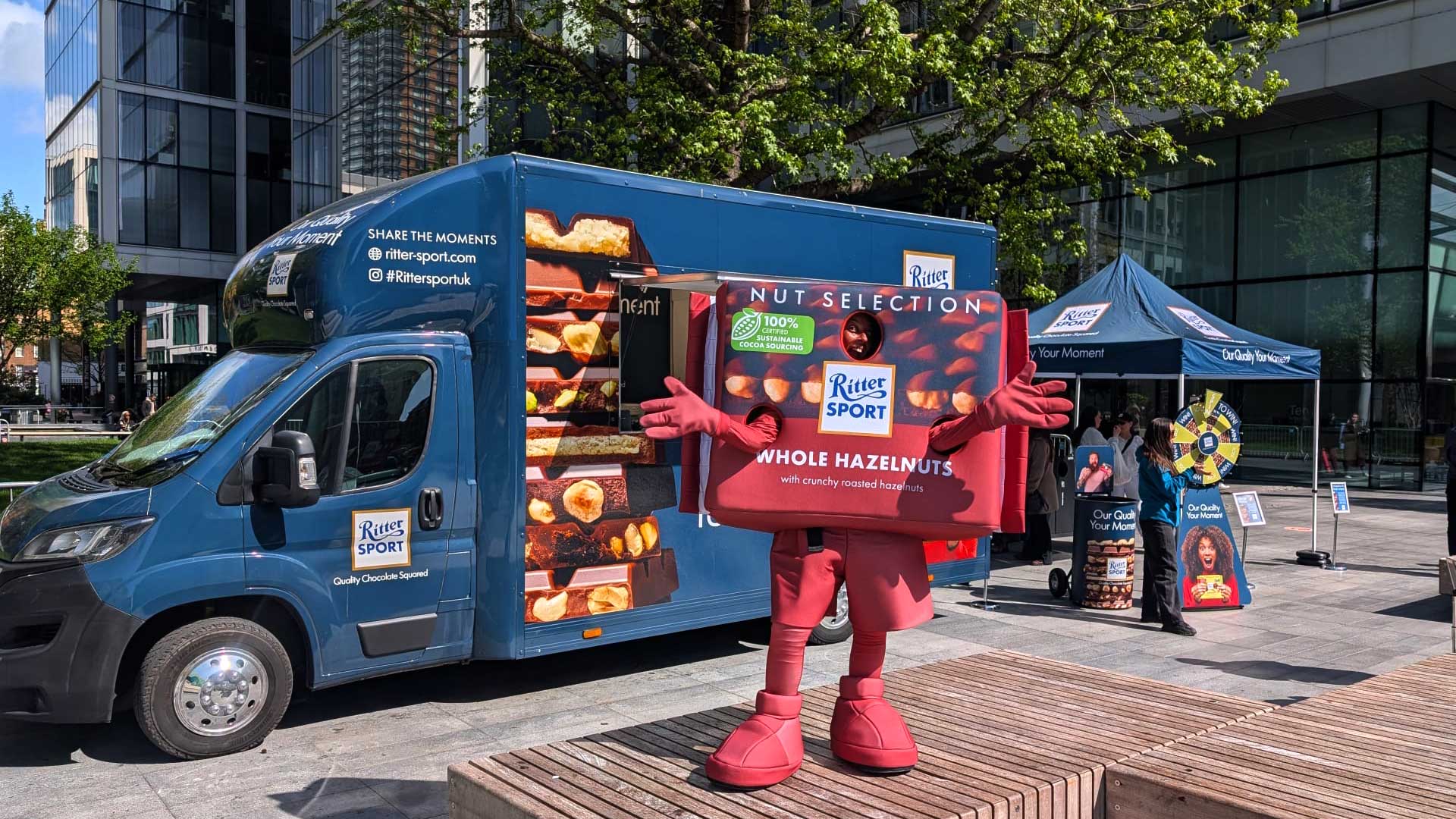 The Ritter Sport Mascot in front of the sampling van